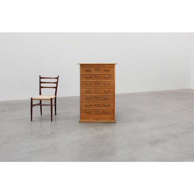 A refined example of early 20th‑century British industrial design, this oak filing cabinet combines utility with timeless...