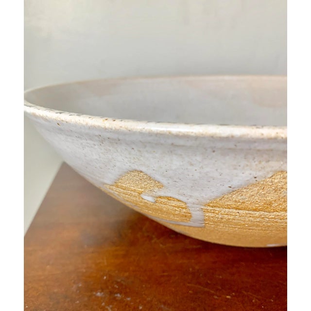 Use this beautiful studio bowl as a centerpiece or to serve salad, a classic organic design Signed on the bottom by artist...