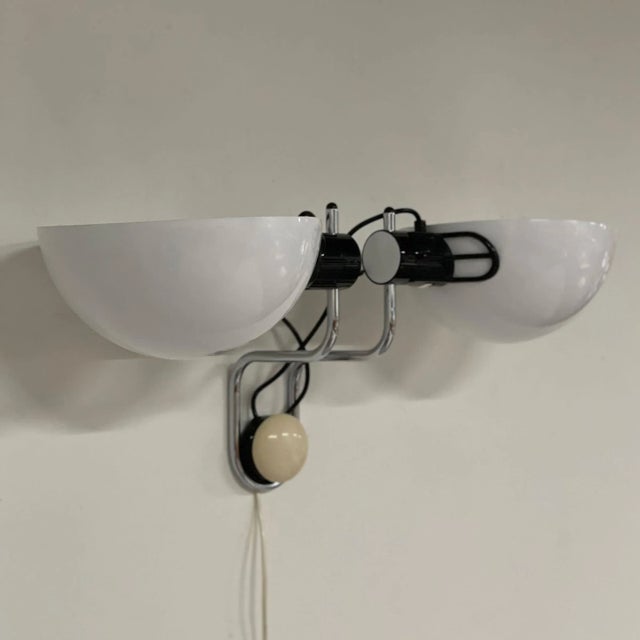 Adjustable Libellule wall lamp from iGuzzini, Italy in 1976. The shades are adjustable and can rotate. Each lamp can also...