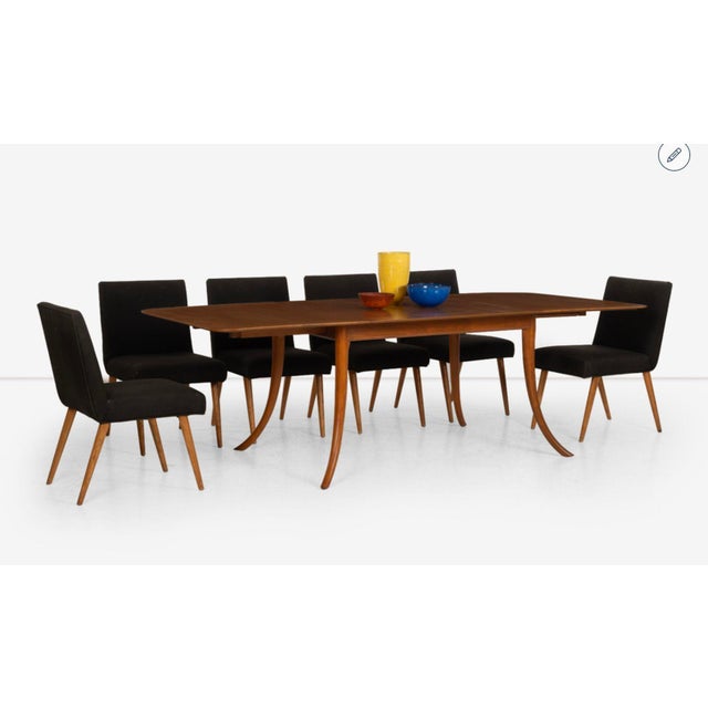 T.H. Robsjohn Gibbings Saber Leg Dining Table Solid Walnut legs with mahogany framed edge to the top. Table is 29" high...