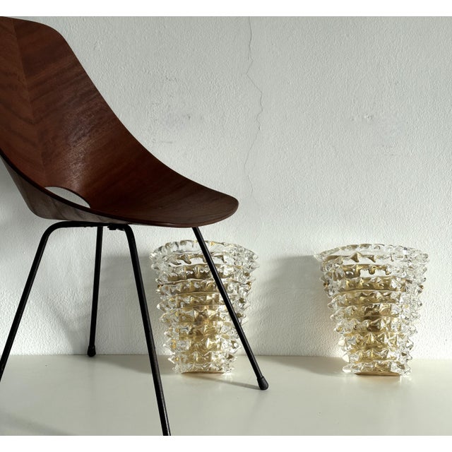 Beautiful set of two large and heavy wall sconces made of brass base and transparent thick original Murano rostrato...