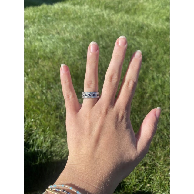 Stones: sapphire round 2.5 mm diamonds round brilliant 1.1 - 1.25 mm approximately .60 total carats F-G color, SI1-2...