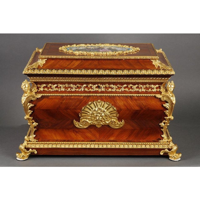 A large louis xv style rosewood veneered casket with gilt bronze mountings. The box has a gilt rosewood veneer on all...