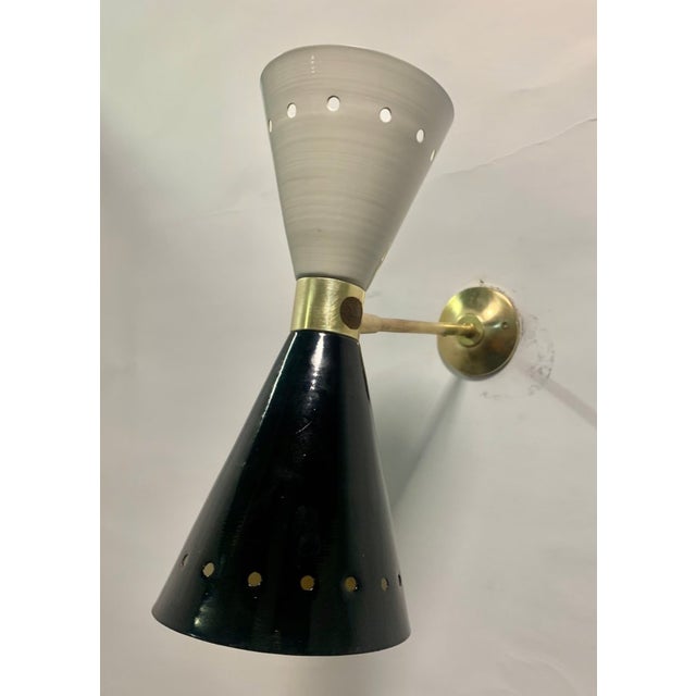 "Diablo" wall sconce - Brass - Restored and Ready to Use For sale are original "Diablo" model wall sconces produced by...