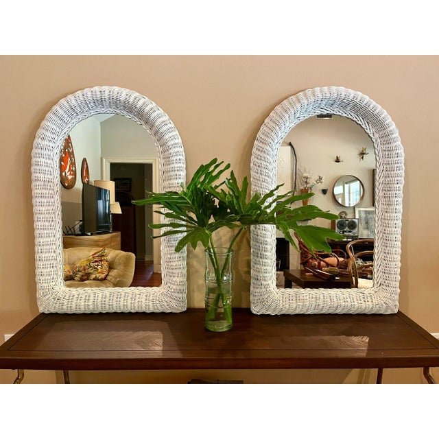 Great pair of vintage wicker mirrors. White, in wonderful vintage condition with wooden backs and a wire for hanging.