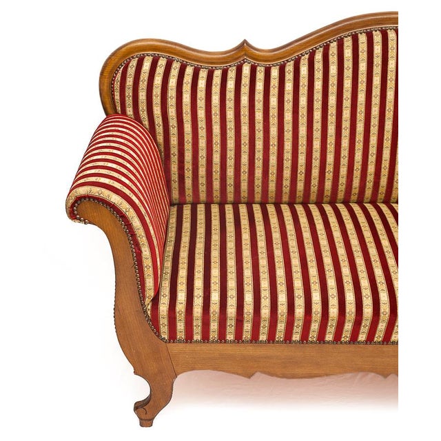 Recamier loveseat or sofa with curved arms. Sound walnut frame. Studded upholstery. Original two-tone red Basque silk...