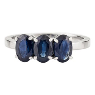 Modern 2 Carat Oval Cut Deep Blue Sapphire Three Stone Ring in 14k White Gold Size 7 For Sale