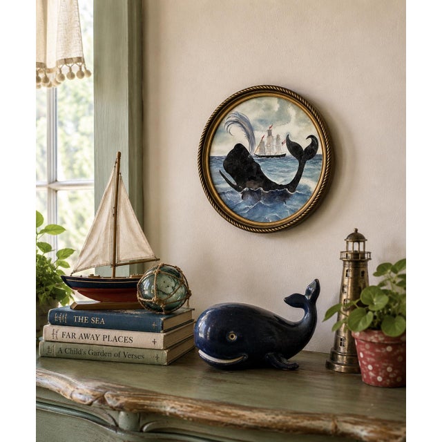 A whimsical hand-textured fine art print featuring a playful whale rising from choppy blue seas as a sailing ship passes...
