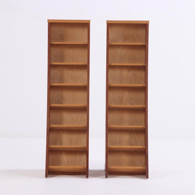 These stunning curved bookcases, each having seven shelves, are two-toned with the interiors having blonde walnut. The...