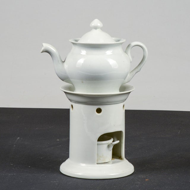 White ceramic teapot by Richard Ginori, complete with an elegant base and candle holder support. Measures 15.5 x 10 x H 22...