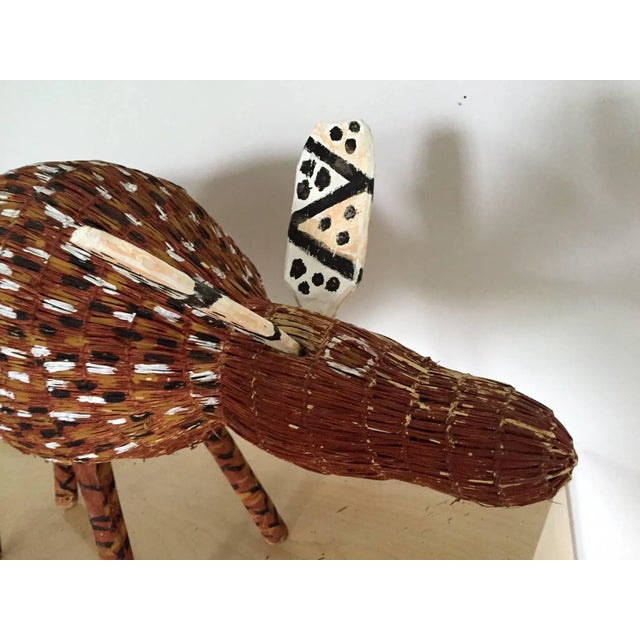 Known as Jamu in Bolkdjam, Northern Territory, Australia, the camp dog was woven Pandanus fibers and painted with earth...