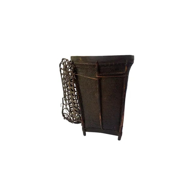 This vintage hand-woven basket originates from the Dayak tribe of Borneo crafted with rattan fibres and an ironwood frame...