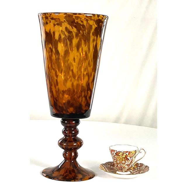 Large trumpet vase on a turned pedestal base-hand blown in a tortoise shell glass sprinkled throughout with gold flecks