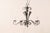 A French five-light iron chandelier. This French vintage mid 20th century chandelier features five s-scrolled and twisted...