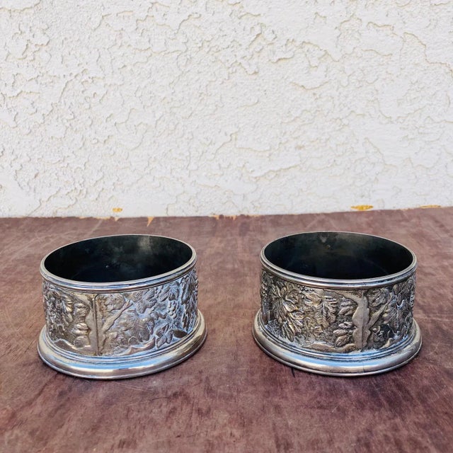These are a lovely pair of Italian silver plate cup / bottle holders. They have a marvelous grape / leaf pattern ethced...