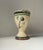 Pedestal vase or small planter in hand-glazed pottery. Decorated with stylized flower and ribbon. Signed by an unknown...