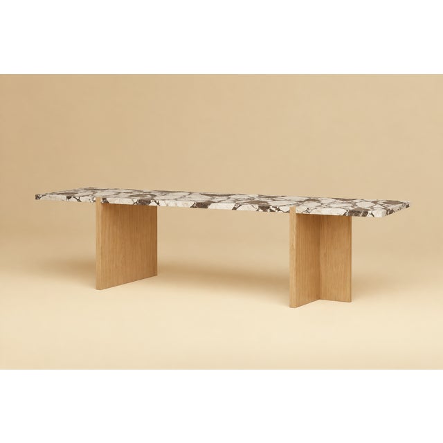The Palm is a Calacatta Viola marble and oak lounge table, a low, elongated table for the space in front of a sofa. Stone...
