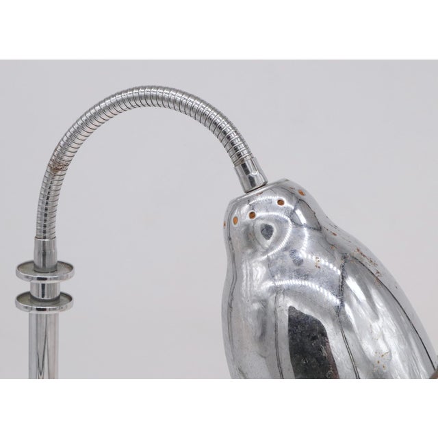Vintage chrome gooseneck table lamp with a polished reflector shade and stepped round base. There are light rust spots...