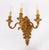 This is a fine antique set of eight French Baroque revival ormolu wall lights, circa 1900 in date. They feature shaped...