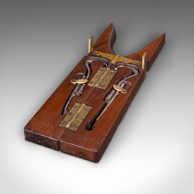 This is an antique Calvary officer's field boot jack. An English, oak and brass campaign shoe pull with tools, dating to...