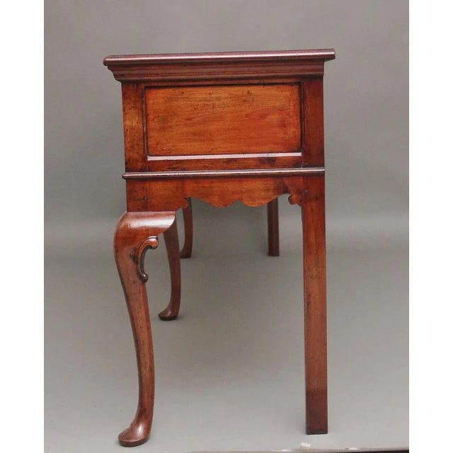 A superb quality mid 20th Century cherry dresser base in the Queen Anne style, having a nice figured and moulded top above...