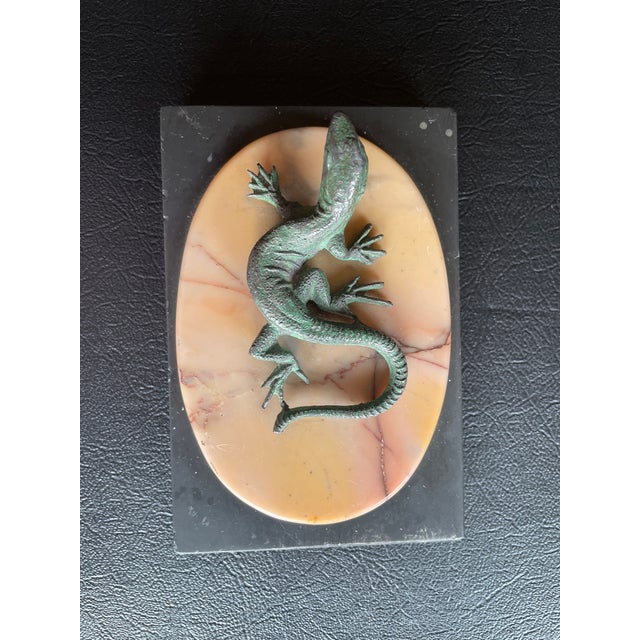 This is a polychrome, mounted on an oval marble plinth above a slated base. This piece is 19th century with measurements...