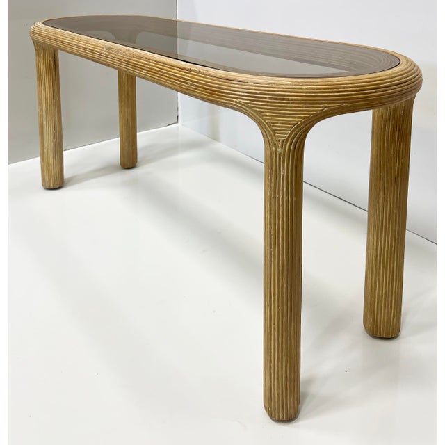 Vintage Pencil Reed Coastal Console Table, Inset Glass Top Offered for sale is a slender vintage pencil reed coastal...