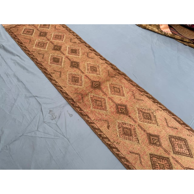 This stunning 1'11" x 8'10" (60 cm x 270 cm) vintage Afghan Mishwani hand-knotted flatweave kilim runner rug is a true...