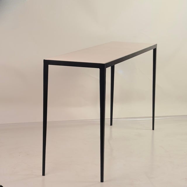 Long 'Étude' wrought iron and honed cream limestone console or sofa table by Design Frères. Slender blackened iron base...