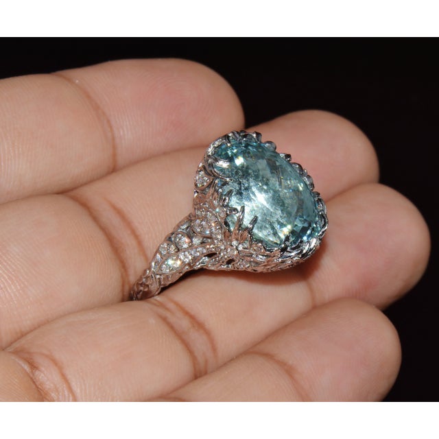 Gorgeous GIA certified aquamarine and diamond cocktail ring. This ring features a very unique sculptural design set with a...