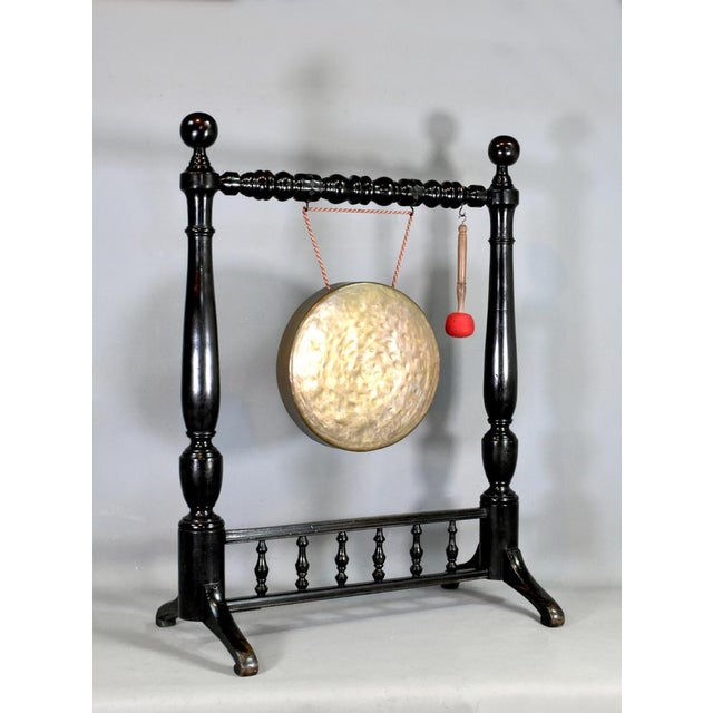Large Framed Dinner Gong in Mahogany This impressive bronze gong hangs from a well-crafted turned stand. The original...