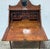 A rare and striking Victorian secretary desk in warm walnut with the kind of presence that stops a room. The carved...