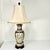 This is a stunning Chinoiserie tall Table Lamp from the 1970s. It features two peacocks on one side and a pair of...