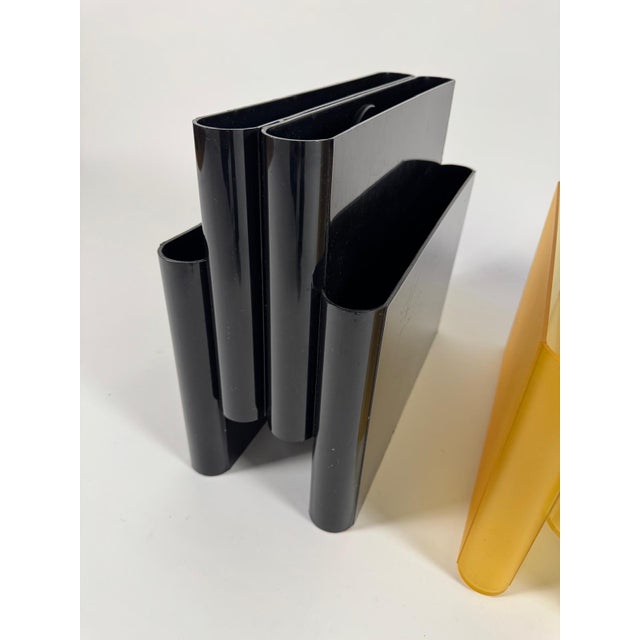 The newspaper rack was designed by Giotto Stoppino for Kartell in the 1970s and is now an absolute design classic....