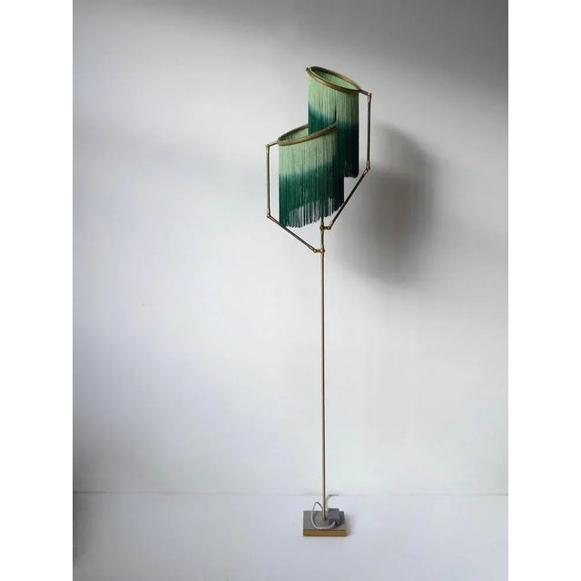 Green charme floor lamp, sander bottinga dimensions: h 153 x w 38 x d 25 cm handmade in brass, leather, wood and dip dyed...