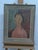 A vintage, reproduction print of "Portrait of a Girl (Victoria)" by Amedeo Modigliani features the artist’s iconic...