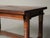 Solid oak dining table features a rectangular top with side extensions, allowing it to expand from 140 cm to 240 cm in...
