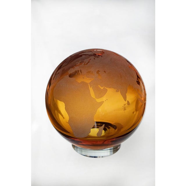 Globe created on a blown amber crystal sphere and hand-engraved transparent crystal base Signed by Maker