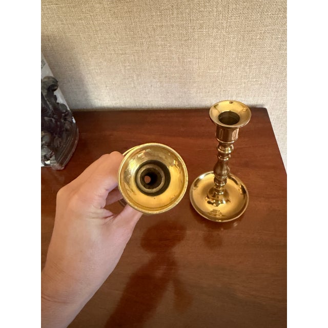 This listing is for a pair of vintage, solid brass, heavy candlestick holders. Each measures 7 3/8" T x 3.75" W