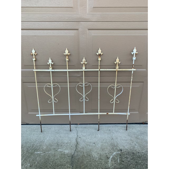 A beautiful French country vintage iron garden trellis with Fleur de lis. This piece will add charm to your country house...