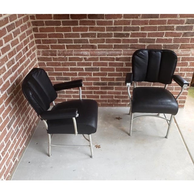 A pair of metal armchairs designed by Warren McArthur (1885-1961) and made by Warren McArthur Corporation for Chrysler...