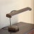 Offering a sleek mid-20th century industrial gooseneck desk lamp in a warm brown (almost taupe) finish. This is a metal...
