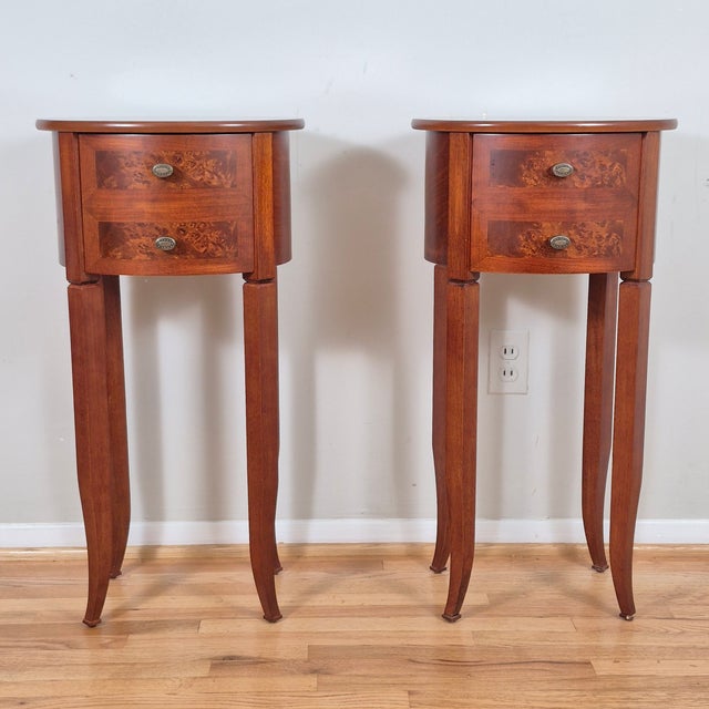 This is an elegant pair of petite oval side tables that is perfect for smaller spaces. Each table measures 15.75” wide,...