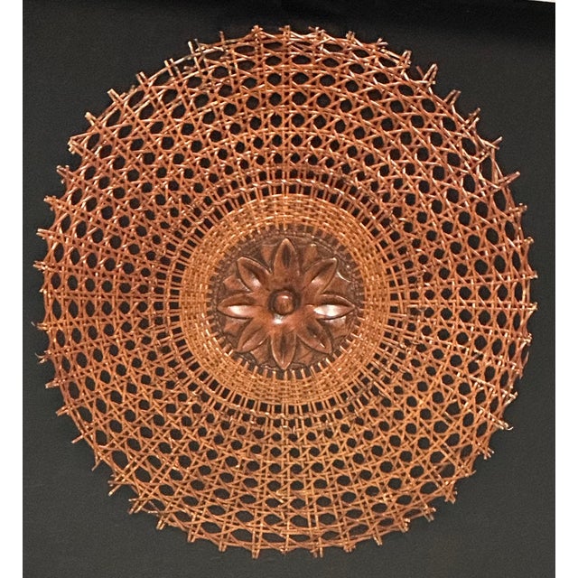 Exquisite hand-carved flowers, meticulously crafted and salvaged from the pair of Louis XVI style chairs, delicately bloom...