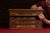 Four-drawer oak spool cabinet with reverse-painted glass advertising inserts reading "GEORGE A. CLARK / SOLE AGENT /...
