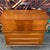 This sleek walnut dresser features a dimensional design with elongated walnut handles that add sophistication. We are...