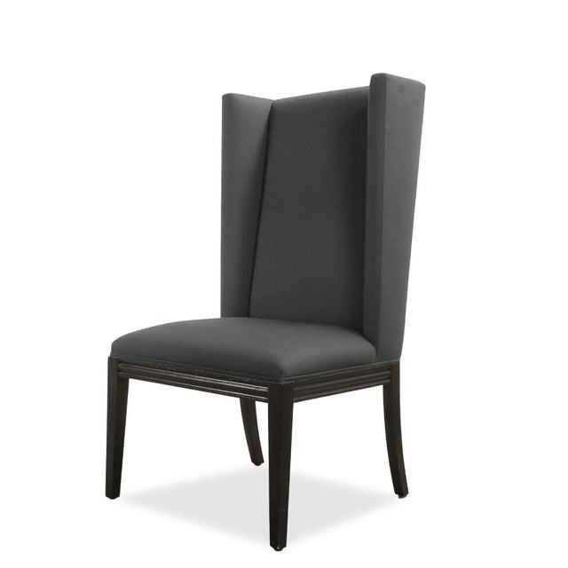 These vintage high back chairs offer a striking blend of tailored elegance and architectural form. Upholstered in Elitis...