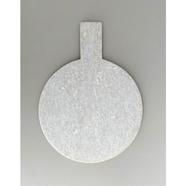 Beautiful brilliant white marble charcuterie cheese board with handle. Serves also as a cutting board, tray, or display...