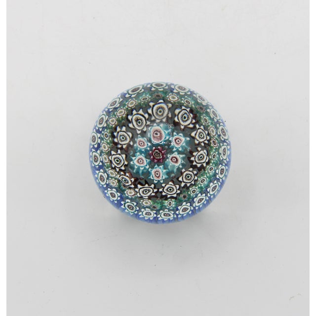 Mid-20th century Murano millefiori paperweight. Finely done with white, blues, green, mauve & pink. 2.75" dia. x 3" h.
