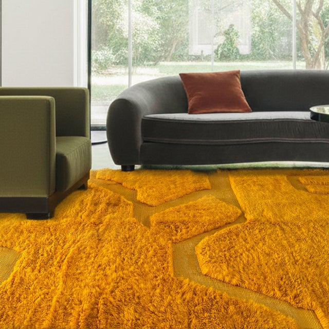 A radiant wash of saffron gold, deepening from burnt orange to warm honey, with faint geometric lines emerging like sun-...